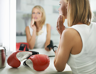 Image showing Female person, bruise and boxing gloves by mirror, makeup and stylish outfit in dressing room. Woman, blush and eyeshadow for sport match, reflection and fashion to prepare for post interview