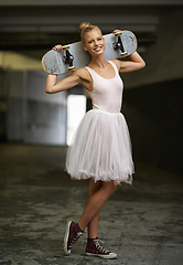 Image showing Portrait, ballet and happy woman with skateboard and sneakers for edgy fashion, trendy outfit and hipster style. Parking lot, aesthetic and ballerina smile for dance hobby, sports and skating skill