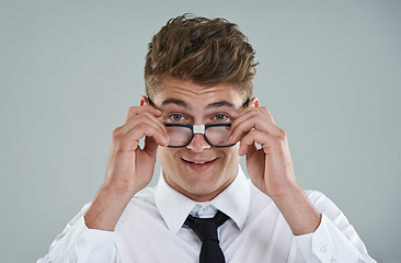 Image showing Businessman, glasses and portrait in studio for optical healthcare, smile and confidence on gray backdrop. Male person, eyewear and proud of frame choice, optometry and lens for vision support