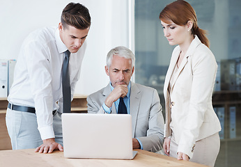 Image showing Business people, laptop and thinking for review in boardroom, communication and meeting in office. Senior manager, team and tech for assistance in training, mentor and contemplation for feedback