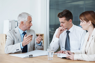 Image showing Contract, negotiation and people in meeting with discussion of policy, advice and consulting with mature lawyer. Legal, advisor and conversation about lawsuit paperwork, document and notes on law