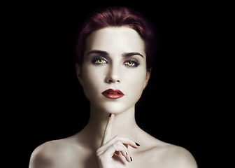 Image showing Vampire, woman and gothic makeup in studio for beauty, cosmetics and dark aesthetic with thinking or scary face. Portrait of villain character, fantasy cosplay and contact lens on a black background