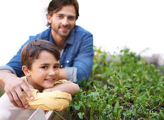 Image showing Dad, son and portrait in garden standing by herbs bed, smiling and outdoors together for growth season. Parent, child and nurture agriculture for sustainability, environment and eco friendly