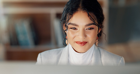 Image showing Happy woman at desk with computer, thinking or typing email, report or article at digital agency. Internet, research and businesswoman at tech startup with online review, networking project and smile