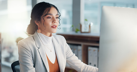 Image showing Businesswoman at desk with computer, thinking or typing email, report or article at digital agency. Internet, research and happy woman at tech startup with online review, networking project and smile