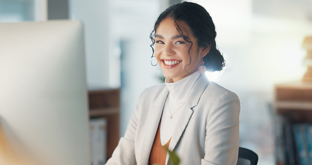 Image showing Woman at desk with computer, smile and typing email, report or article at digital agency. Internet, research and happy businesswoman at tech startup with online review, networking or project at work.