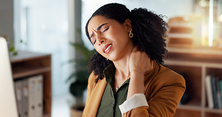 Image showing Woman, neck and hand is sore, office and ache or cramp, laptop and business or pain. Businesswoman, injury and entrepreneur of startup, massage and arthritis or frustrated, fatigue and workplace