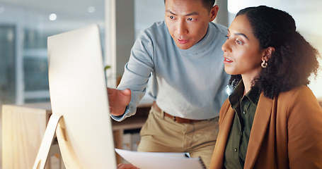 Image showing Business people, documents and coaching in schedule planning, project or strategy together at office. Man giving paperwork to woman for review, plan or tasks on computer in team research at workplace