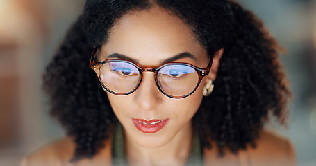 Image showing Business woman, reading and research on computer for online project, article review and editing or night analysis. Happy african editor or journalist with screen in glasses reflection for news report