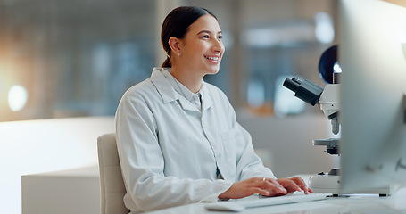 Image showing Science, research and happy woman with computer, typing and biotech data report in laboratory. Medical innovation, scientist or lab technician in study in healthcare, medicine or online test feedback