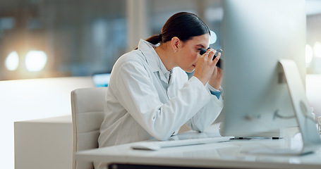 Image showing Science, research and woman with microscope, computer and typing data report in laboratory. Medical innovation, scientist or lab technician in study for healthcare, medicine and vaccine test feedback