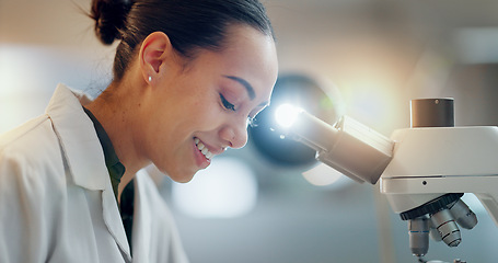 Image showing Laboratory, research and happy woman with microscope, future technology and biotech data in science. Medical innovation, scientist or lab technician in study for healthcare, medicine and vaccine test