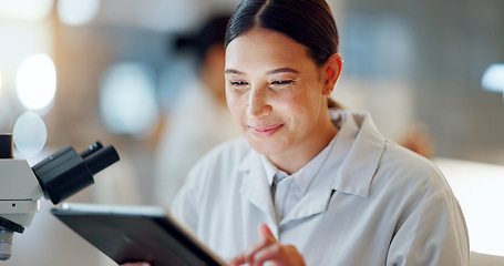 Image showing Scientist, woman and tablet, microscope or laboratory research for DNA analysis and happy with medical study. Student or science expert in biotechnology with digital software and lens check for data