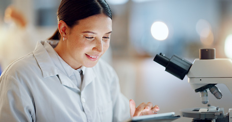 Image showing Scientist, woman and tablet, microscope or laboratory research for DNA analysis and happy with medical study. Student or science expert in biotechnology with digital software and lens check for data