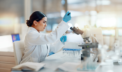 Image showing Science, laboratory and woman with pipette, test tube and biotech solution in research. Medical innovation, scientist or lab technician in study for healthcare, medicine and vaccine results feedback.