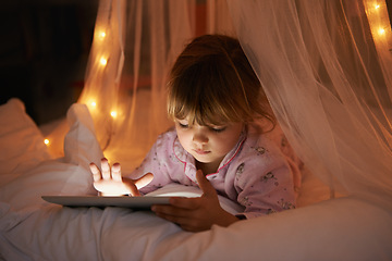 Image showing Little girl, bed and tablet at night, browsing and watching with technology for streaming or learning. Child, tech and internet for online games or digital reading with touch and internet in bedroom