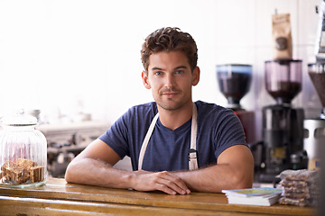 Image showing Man, barista and portrait in coffee shop, counter and working in restaurant or small business. Male person, entrepreneur and professional in bistro, confidence and pride in career and hospitality