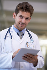 Image showing Smile, tablet and portrait of doctor in hospital for medical research on the internet for diagnosis. Happy, professional and male healthcare worker with telehealth on digital technology in clinic.