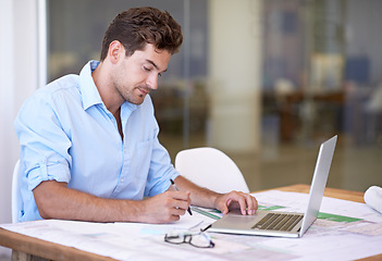 Image showing Architect, laptop and man in office with blueprint, thinking and reading paper for renovation. Designer, engineer or creative developer at desk with building plan, computer and property upgrade.