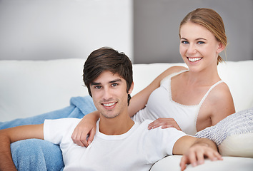 Image showing Couple, living room and lying with sofa, portrait and lounge for relaxation and love or smile. People, home and romance for comfortable valentines day date and happiness for bonding and relationship