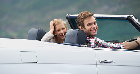 Image showing Couple, portrait and convertible driving on road or adventure in California or outdoor, journey or vacation. Man, woman and environment in nature or relaxing trip with transport, weekend or happy