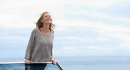 Image showing Smile, blue sky and convertible car with woman on road trip for travel, vacation or holiday in summer. Mockup, driving and journey with happy young person in vehicle for transport in fresh air