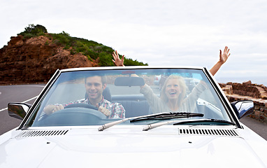 Image showing Couple, driving and convertible or excited or travel on mountain road or weekend trip, adventure or journey. Man, woman and transportation on hill in California or summer tourism, holiday or vacation