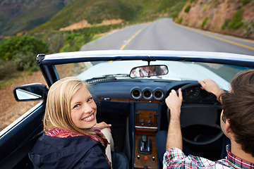 Image showing Couple, driving and convertible steering wheel on mountain from behind for vacation happy, adventure or holiday. Man, woman and portrait on transportation in California for travel, relax or nature