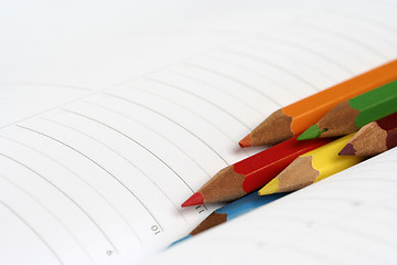 Image showing Color pencil and agenda