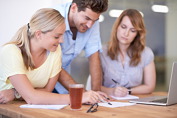 Image showing People, desk and laptop for brainstorming, teamwork and collaboration in modern office in Canada. Employees, workers or colleagues with smiles, table and paperwork for business or team meeting