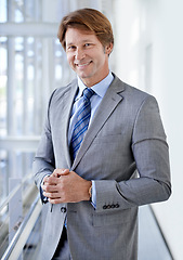 Image showing Businessman, corporate and portrait in office with smile for professional career, job and finance for company. Person, employee and work as financial consultant, formal and face with workplace