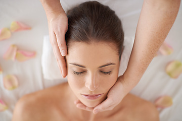 Image showing Hands, top view and face massage of woman at spa to relax, peace or calm for aromatherapy with organic flowers. Above, therapy and person at salon for facial treatment, skincare and natural beauty