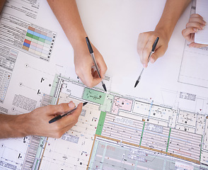 Image showing Architecture, hands and team in office with floor plan, strategy and project management meeting. Engineering, blueprint and people problem solving together in collaboration for remodeling from above