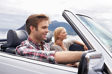 Image showing Couple, convertible and driving on mountain road in nature for bonding adventure for holiday, journey or travel. Man, woman and car in California for vacation destination or connection, trip or view