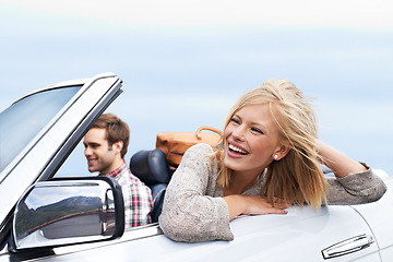 Image showing Happy, travel and couple in car for transportation on adventure, holiday or vacation with suitcases. Smile, love and young man and woman driving in vehicle for weekend road trip journey together.