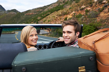 Image showing Suitcases, driving and portrait of couple in a car for travel to vacation, adventure or holiday destination. Happy, love and young man and woman on journey in vehicle for weekend road trip together.