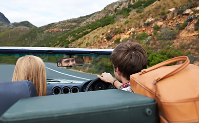 Image showing Luggage, driving and back of couple in a car for travel to vacation, adventure or holiday destination. Nature, outdoor and young man and woman on journey in vehicle for weekend road trip together.