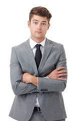 Image showing Portrait, serious and arms crossed with business man in studio isolated on white background for review. Company, corporate and mission with young human resources employee in suit for feedback
