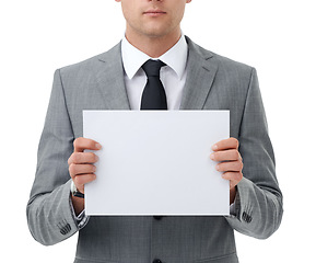 Image showing Hands, poster and marketing with business man in studio isolated on white background for closeup advertising. Corporate, mock up and space for information with employee holding sign or placard