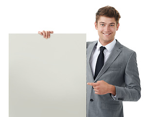 Image showing Portrait, employee and man with a poster, pointing and feedback isolated on white studio background. Option, promotion or model with blank card or mockup space with consultant, review or announcement