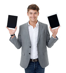 Image showing Portrait, smile and tablet with business man in studio isolated on white background for tech options. Choice, decision and compare with happy young employee showing screen or display for website