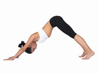 Image showing Woman, yoga and stretching body in workout, exercise or training on a white studio background. Young female person or yogi in warm up, balance or pose for zen, pilates or fitness on mockup space