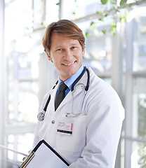 Image showing Doctor, smile and portrait with clipboard in hospital for schedule, report or patient records with stethoscope. Medical professional, face and paper for information, checklist or health insurance