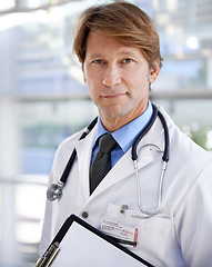 Image showing Portrait, doctor and clipboard in hospital for healthcare, documents or patient records. Face, medical professional and paper for information, checklist or treatment plans for cardiology at clinic