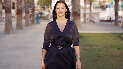 Image showing Elegant Woman in Black Dress Walking in Spain