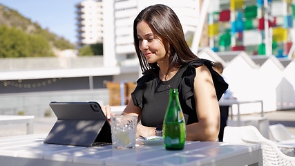 Image showing Professional Woman Working on Tablet Outdoors in Spain