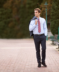 Image showing Jacket over his shoulder, business and man walking, park and professional with confidence. Person, outdoor and lawyer with a suit or fresh air with pose or entrepreneur with ideas, decision or choice