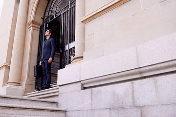 Image showing Lawyer, business and thinking with man, stairs and peaceful with professional and confidence. Person, outdoor and attorney with suitcase and office buildings with ideas and worker with legal aid