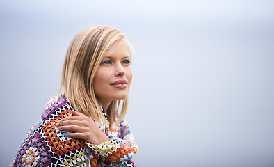 Image showing Thinking, clouds and woman with blanket in nature for adventure on holiday, vacation and weekend outdoors. Winter, travel and face of person for relaxing, happiness and peace in countryside for calm