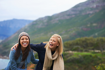 Image showing Friends, laugh and women on mountain happy for adventure on holiday, vacation and weekend outdoors. Nature, travel and people by seaside for hike, funny joke and bonding together in countryside